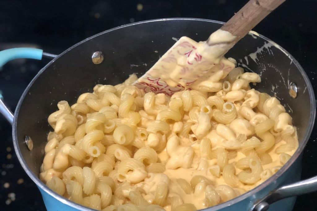 Cooked pasta added to the cheese sauce mixture for Smoked Cheddar Macaroni and Cheese recipe