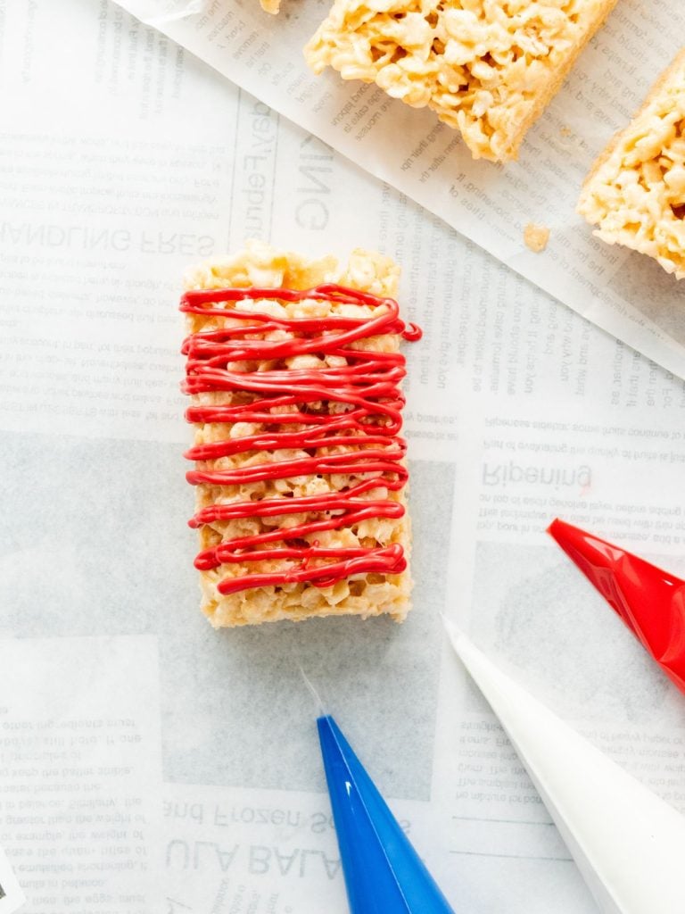 A rice krispie marshmallow treat in the process of being decorated