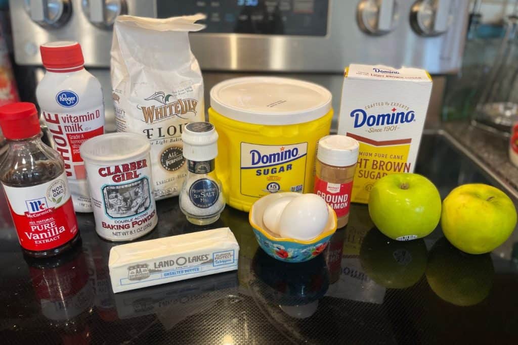 Ingredients for Apple cinnamon streusel crumble muffins including vanilla, baking powder, milk, all purpose flour, sugar, salt, butter, eggs, cinnamon, brown sugar and granny smith apples.
