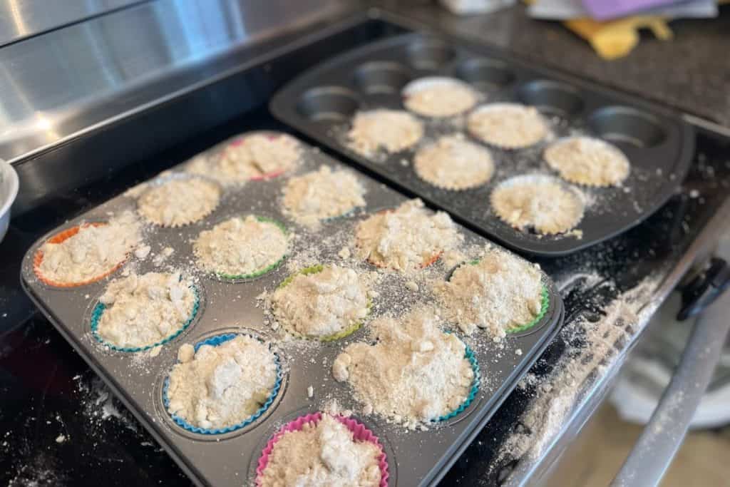 Apple cinnamon streusel crumble muffins ready to go into the oven