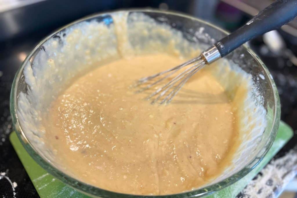 Apple cinnamon streusel crumble muffin batter mixed and ready to have apples added to it
