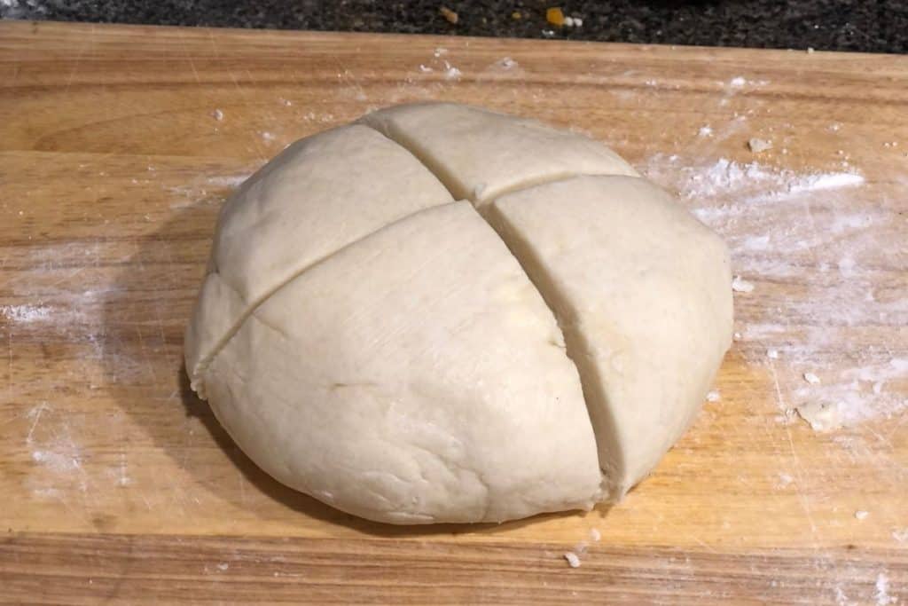 The homemade pie pastry dough cut into four sections