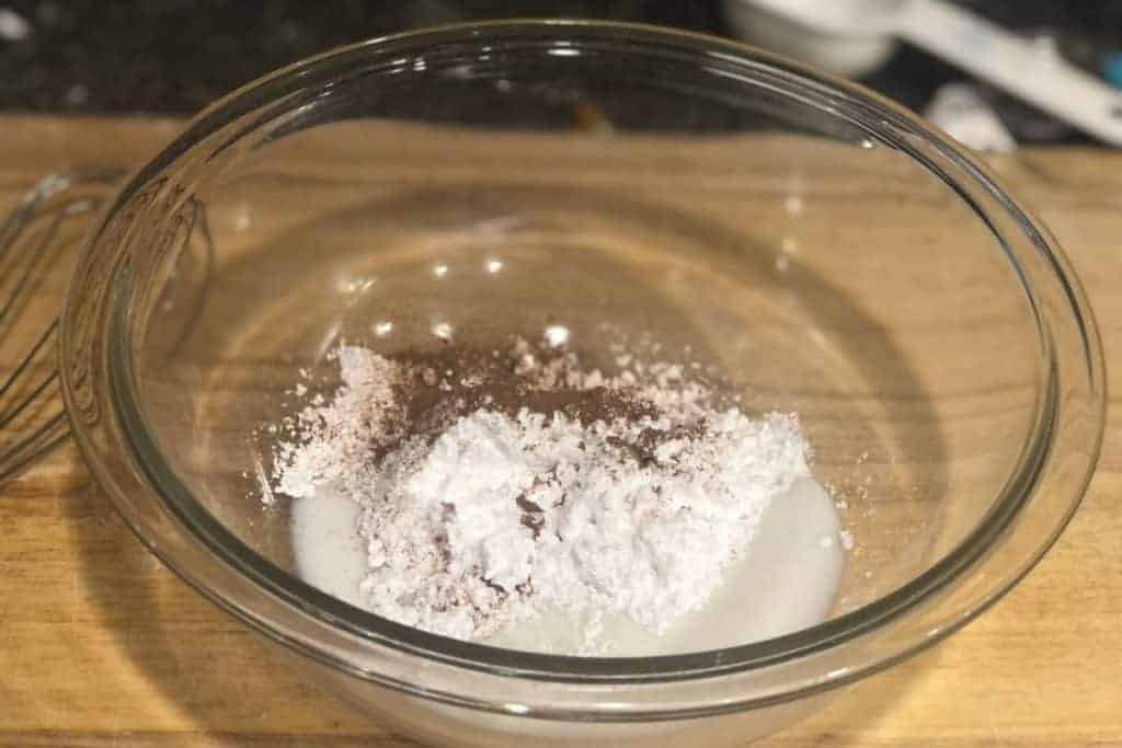 milk, powdered sugar and cinnamon in a bowl that will become the icing for the homemade brown sugar cinnamon pop tarts