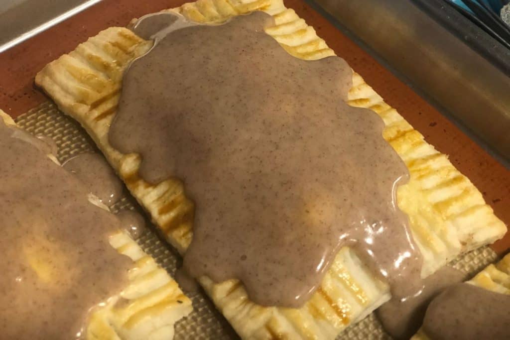 Homemade brown sugar cinnamon pop tarts close up on a baking sheet