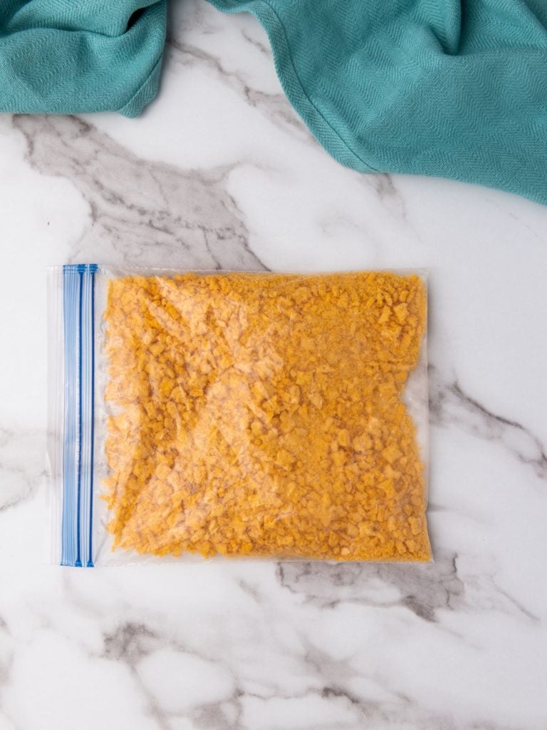 A gallon-sized zip lock bag full of crushed captain crunch cereal