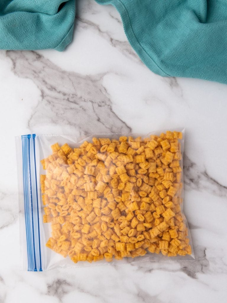 A gallon-sized freezer bag with Captain Crunch cereal inside it