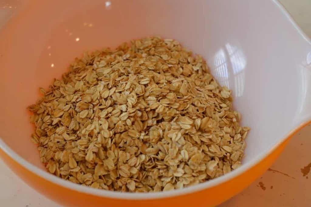 Toasted oats poured into a large mixing bowl