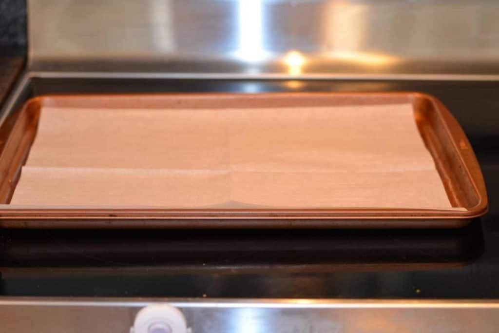 A sheet pan lined with parchment paper.