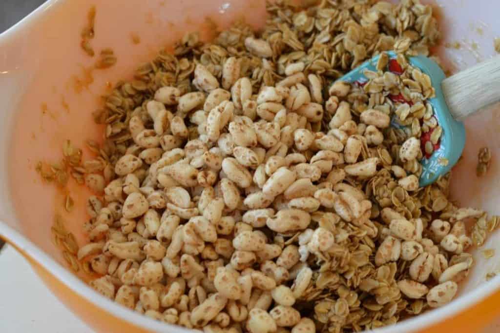 puffed wheat added into the gooey granola mixture