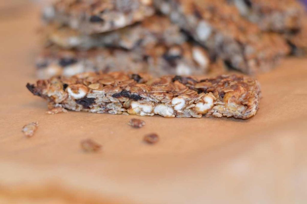 A side view of a sliced up Cherry Chocolate Chip Granola Bar